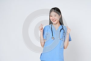 Smiling woman doctor showing mini heart sign isolated on white background