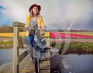 Smiling woman in Dutch countryside.