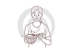 Smiling woman eating healthy vegetable salad