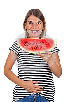 Smiling woman eating watermelon & holding her abdomen