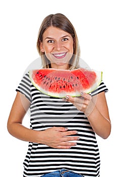 Smiling woman eating watermelon & holding her abdomen