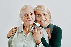 Smiling Woman Embracing Mother