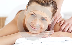 Smiling woman enjoying a back massage