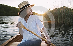 Smiling woman enjoying a canoe ride