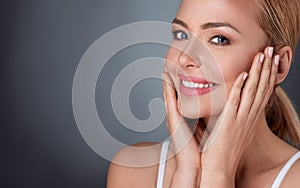 Smiling woman enjoying in her healthy skin