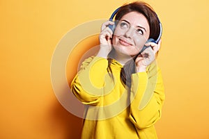 Smiling woman enjoying relaxing songs