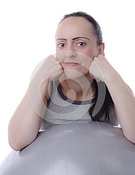 Smiling woman on exercise ball