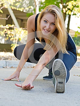 Smiling woman exercising outdoors