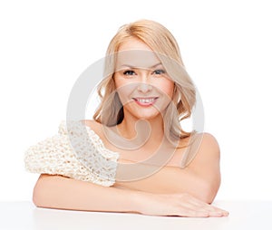 Smiling woman with exfoliation glove