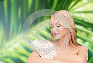 Smiling woman with exfoliation glove