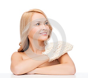 Smiling woman with exfoliation glove