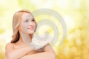 Smiling woman with exfoliation glove