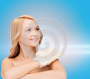 Smiling woman with exfoliation glove