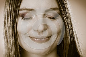 Smiling woman face with closed eyes, girl daydreaming