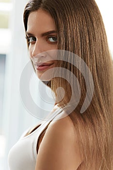 Smiling Woman Face With Natural Makeup And Long Healthy Hair