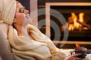 Smiling woman with facial mask