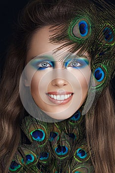 Smiling woman fashion model with bright makeup, studio portrait. Beautiful face closeup