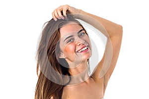 Smiling woman fixing her hair