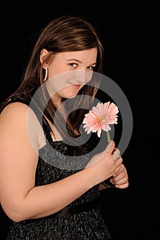 Smiling woman with flower