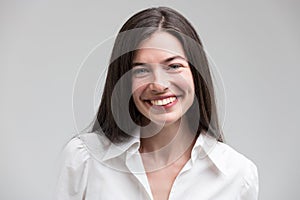 Smiling woman in formal white shirt