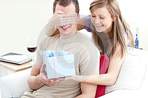 Smiling woman giving a present to her boyfriend