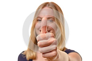 Smiling woman giving a thumbs up of approval