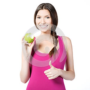 Smiling woman with green apple