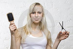 Smiling woman hairdresser with professional tools