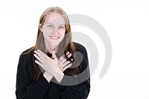 Smiling woman hands on chest bust looks side copy space white background