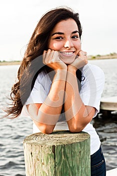 Smiling Woman with hands in face