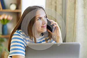 Woman Working from Home on a Phone Call