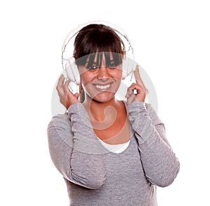 Smiling woman with headphone listening music