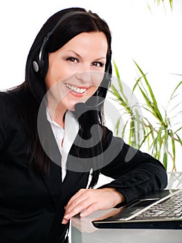 Smiling woman with headphone in office