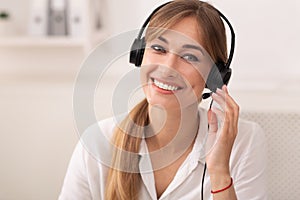Smiling Woman In Headset Working In Call Center Office