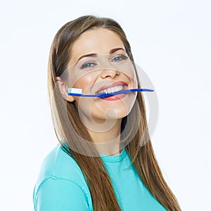 Smiling woman with healthy teeth holding toothy brush.