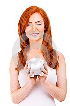 Smiling woman with her piggy bank
