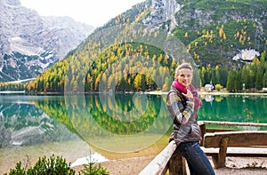 Smiling woman hiker at Lake Bries holding scarf