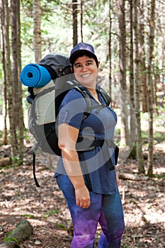 Smiling woman with hiking gear