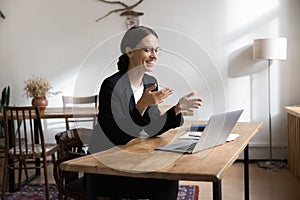 Smiling woman hold briefing event using laptop and videocall application photo