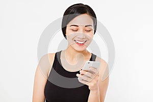 Smiling woman hold cellphone. Closeup young happy beautiful asian japanese woman. Girl looking at mobile cellphone isolated on whi