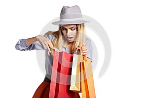 Smiling woman hold shopping bag.