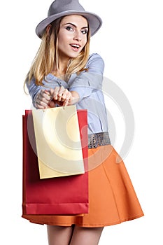 Smiling woman hold shopping bag.