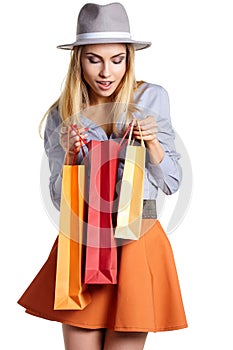 Smiling woman hold shopping bag.