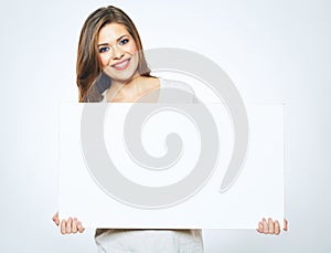 Smiling woman holding blank business sign board