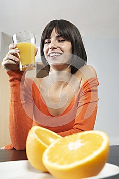 Smiling Woman Holding Glass With Orange Juice