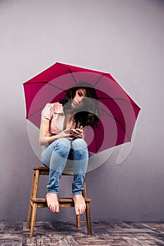 Smiling woman holding her hair