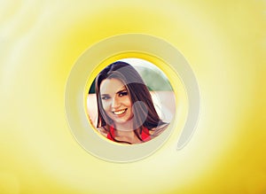 Smiling woman holding inflatable circle