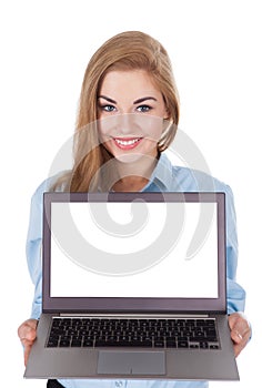 Smiling woman holding laptop