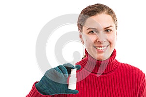 Smiling woman holding nasal spray