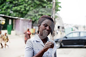 Smiling woman holding a packet of chips